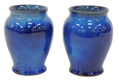 Lot 516 - A pair of small blue glazed earthenware ovoid...