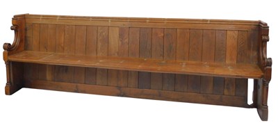 Lot 647 - A 19thC oak church pew, with a panelled back,...