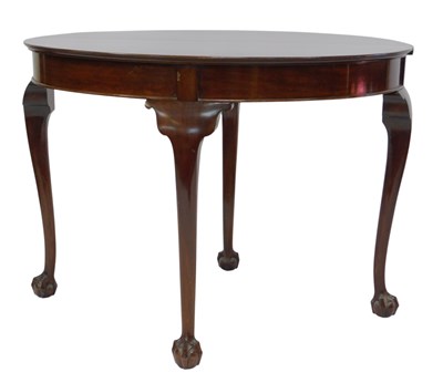 Lot 715 - A mahogany demi lune tea table, with carved...