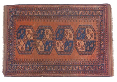 Lot 722 - A Turkoman rug, red ground, with four central...