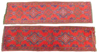 Lot 723 - A pair of Turkish Oushak runners, red ground,...