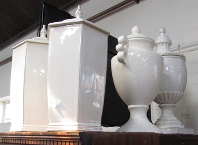 Lot 2030 - Four white ceramic urns with lids.