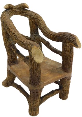 Lot 103 - A 19thC fantasy faux bois stoneware chair,...