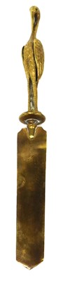Lot 224 - A Victorian brass paper knife, the handle cast...