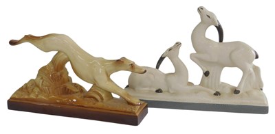 Lot 478 - An Art Deco style brown glazed pottery figure...