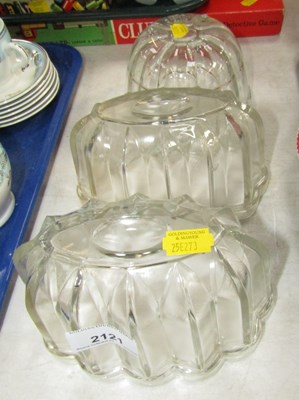 Lot 2121 - Three glass jelly or blancmange moulds.