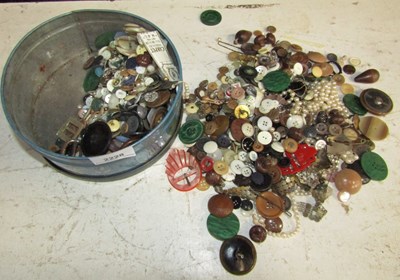 Lot 2228 - A tin containing various buttons, faux pearl...