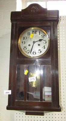 Lot 2242 - An oak cased wall clock, the silvered circular...