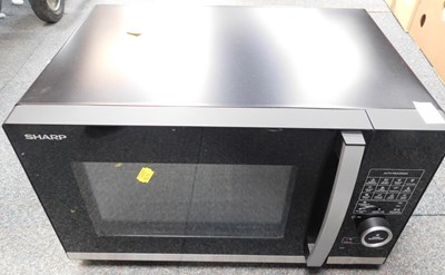 Lot 2191 - A Sharp combi microwave, finished in black.