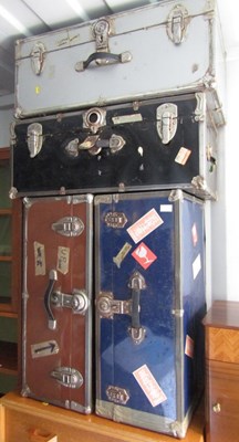 Lot 1025 - Four metal-bound shipping trunks.