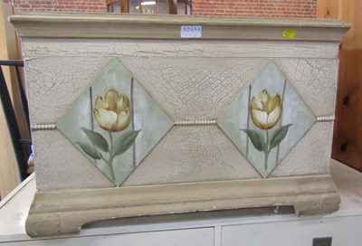 Lot 1063 - A small painted trunk with floral relief.