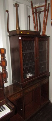 Lot 1115 - An Old Charm style bookcase, and a side...