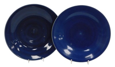Lot 56 - A pair of deep blue ground porcelain dishes,...