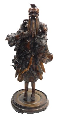 Lot 10 - A 19thC Chinese rootwood carving of Shou Lao,...