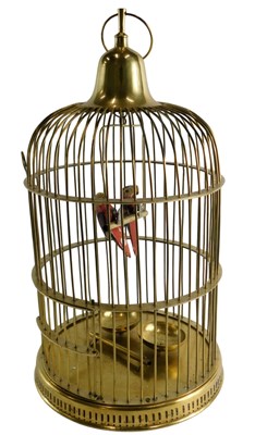 Lot 118 - A brass parrot cage, containing two painted...