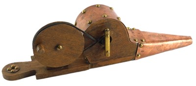 Lot 143 - A pair of oak and brass mechanical...