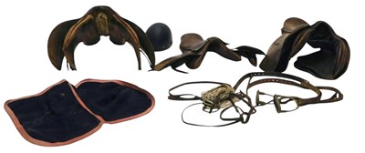 Lot 219 - Three leather saddles, etc.