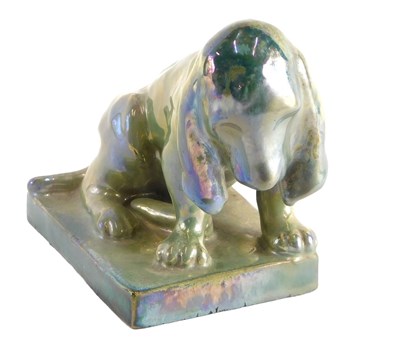 Lot 494 - A French Rambervillers figure of a seated dog...