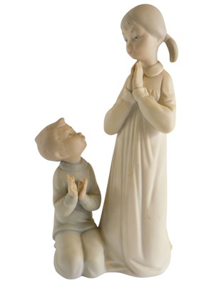 Lot 276 - A Lladro porcelain figure of a young girl and...