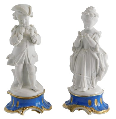 Lot 244 - A pair of 19thC part bisque porcelain figures...