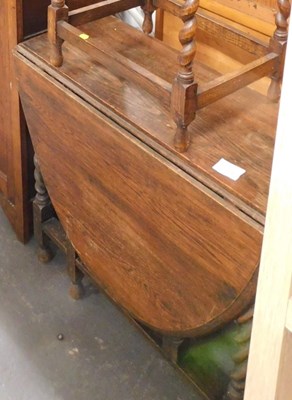 Lot 1548A - An oak drop leaf gateleg dining table, with...