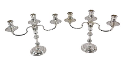 Lot 4 - A pair of Elizabeth II three branch silver...