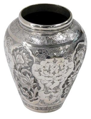 Lot 299 - A small Indian silver coloured metal vase,...