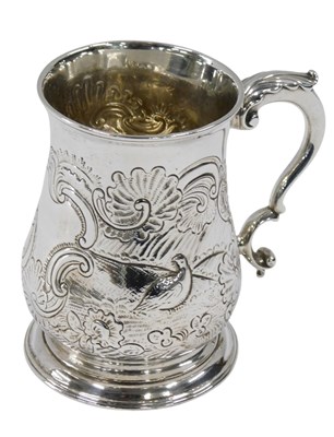 Lot 301 - A George III silver mug, with embossed and...
