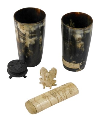 Lot 321 - A small bone carving of three monkeys, two...