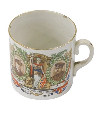 Lot 371 - A WWI commemorative mug, printed and decorated...