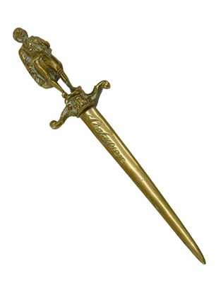 Lot 394 - A brass paper knife, the handle cast as...