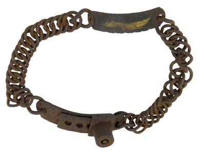 Lot 404 - A 19thC iron and brass slave collar, engraved...