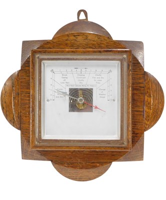 Lot 463 - An Art Deco oak and silvered aneroid barometer,...