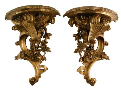 Lot 576 - A pair of giltwood and gesso wall brackets, in...
