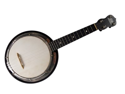 Lot 244 - A George Formby walnut ukulele banjo, 54cm long.
