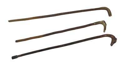 Lot 623 - A wooden walking stick, with carved Greyhound...