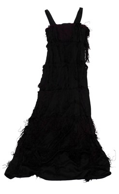 Lot 630 - A 1930s style black satin and maroon tassled...