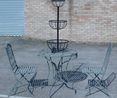 Lot 798 - A green painted metal garden or patio table,...