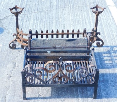 Lot 803 - A wrought iron fire basket, decorative scroll...
