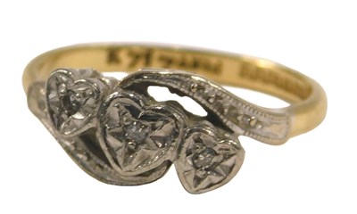 Lot 88 - A gold platinum and diamond three stone...