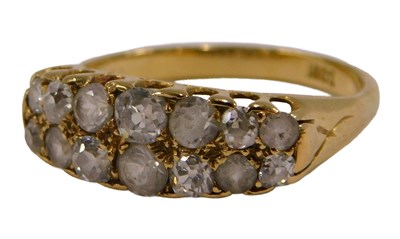 Lot 90 - A diamond and white stone fourteen stone...