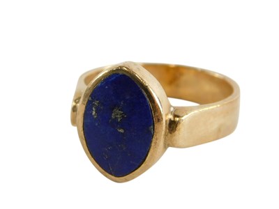 Lot 80 - A 9ct gold and lapis lazuli ring, in an ovoid...