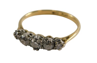 Lot 325 - A diamond five stone ring, claw set, in white...