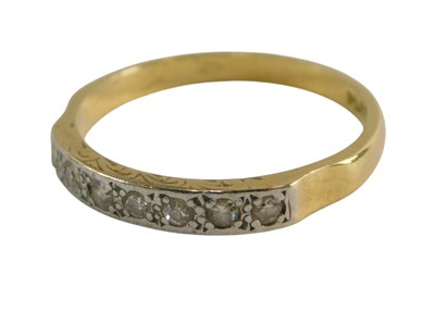 Lot 309 - A diamond seven stone ring, in a rub over...