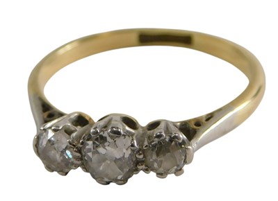 Lot 316 - A diamond three stone ring, claw set, in...
