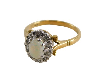 Lot 307 - An 18ct gold opal and diamond ring, the...