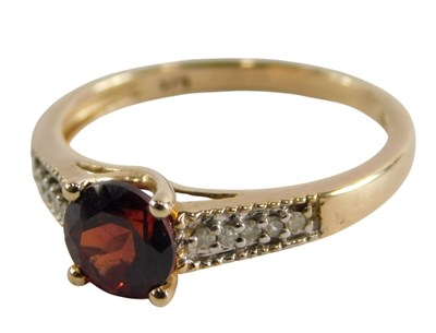 Lot 363 - A 9ct and garnet single stone ring, with...
