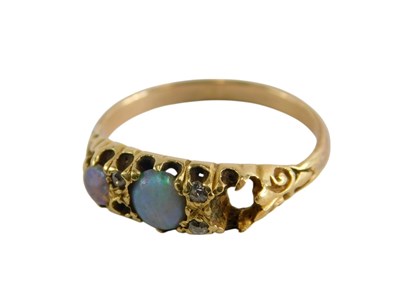 Lot 330 - A three stone ring, one opal lacking, set with...