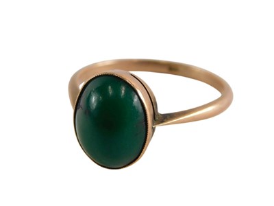Lot 329 - A green agate cabochon single stone ring, in...