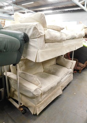Lot 1609 - A cream upholstered three seater settee, with...